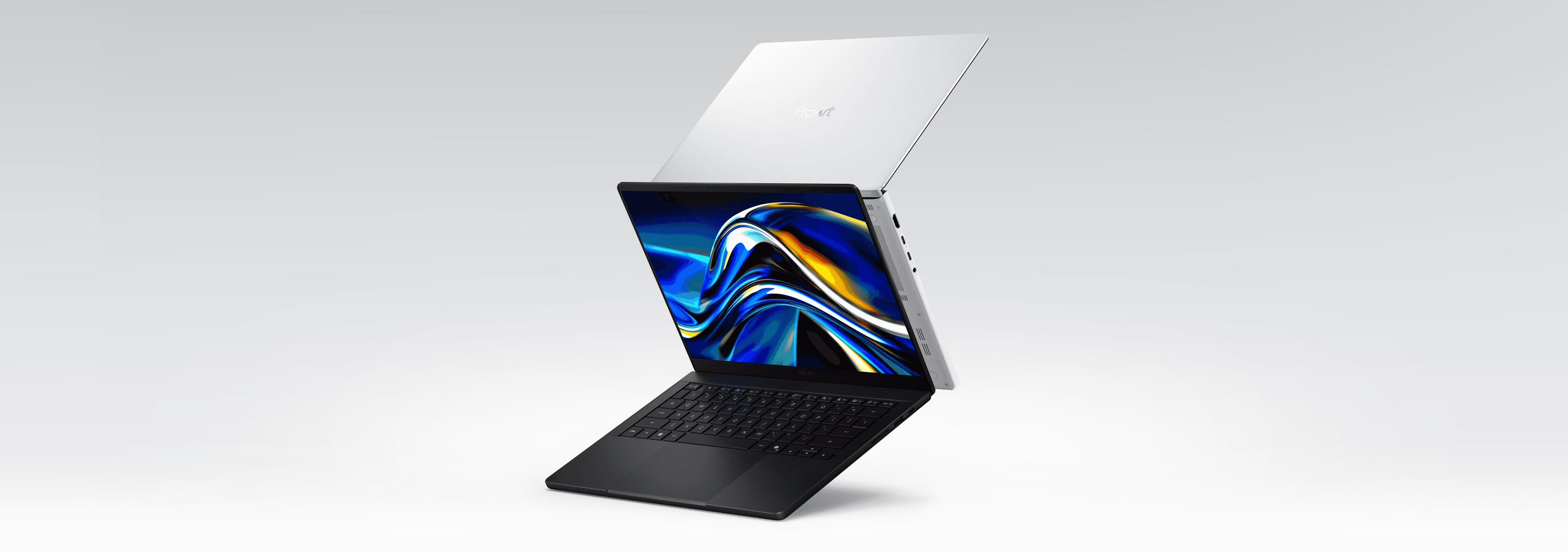 ASUS ProArt P14 H7407 shown in black and white finishes.