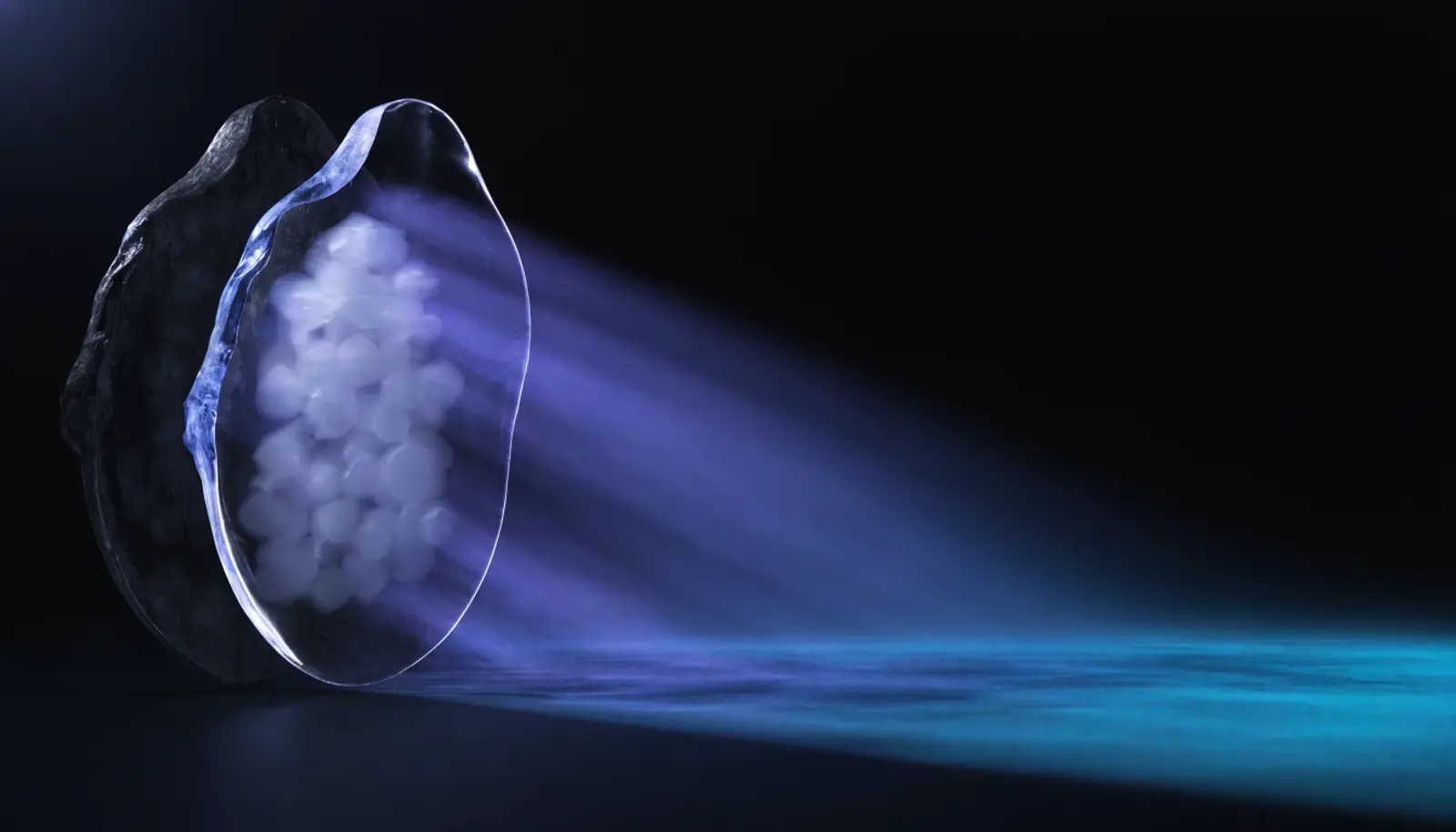 An illustration of a translucent shell with light travelling outward from it onto a broad surface to the right, a second heavier shell behind it lit only from outside, and inside the near shell a soft indistinct mass of small forms too blurred to count.
